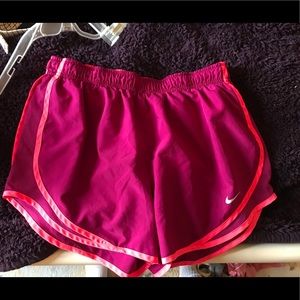 neon pink and maroon nike free run shorts